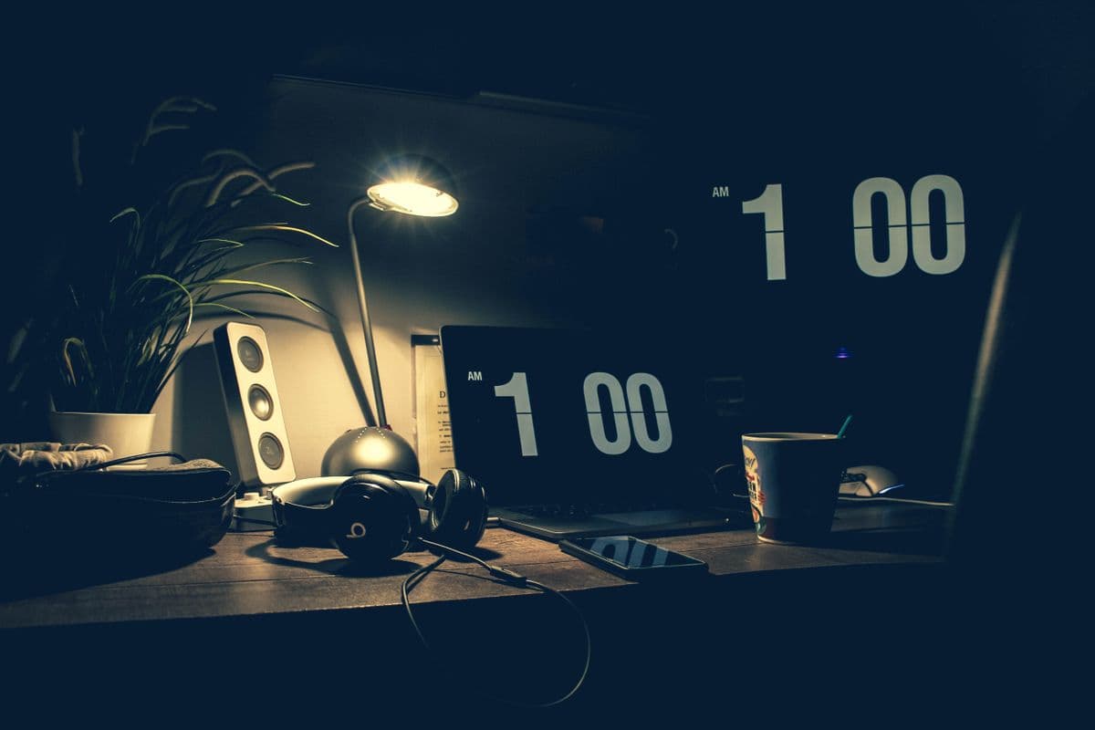 A desk clock late at work